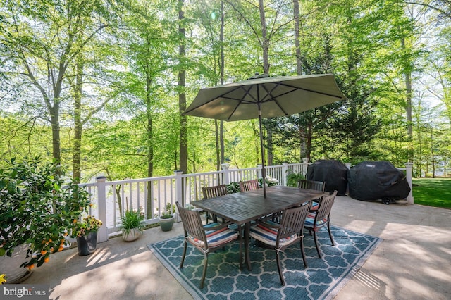 view of patio with area for grilling and outdoor dining space