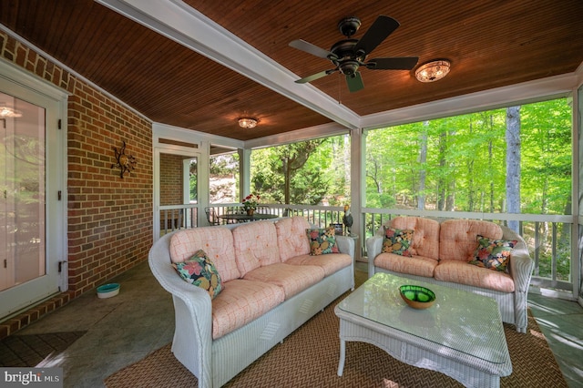 sunroom / solarium with a ceiling fan, a wealth of natural light, and outdoor lounge area