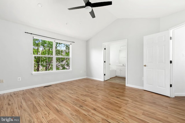 5830 Shady Oak Ln, Elkridge, MD 21075 - unfurnished bedroom featuring lofted ceiling, light wood-type flooring, connected bathroom, ceiling fan, and baseboards