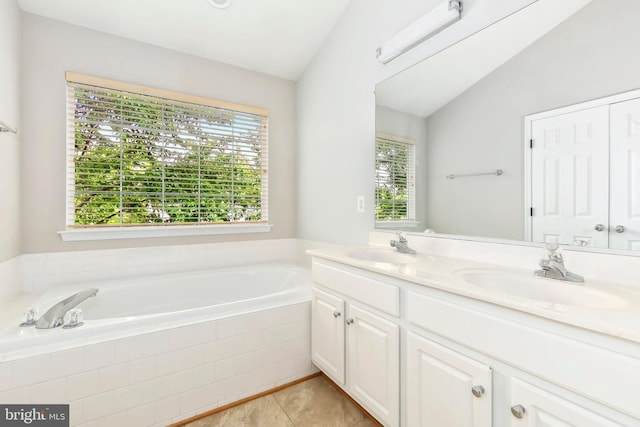 5830 Shady Oak Ln, Elkridge, MD 21075 - full bath featuring a garden tub, double vanity, tile patterned flooring, and lofted ceiling