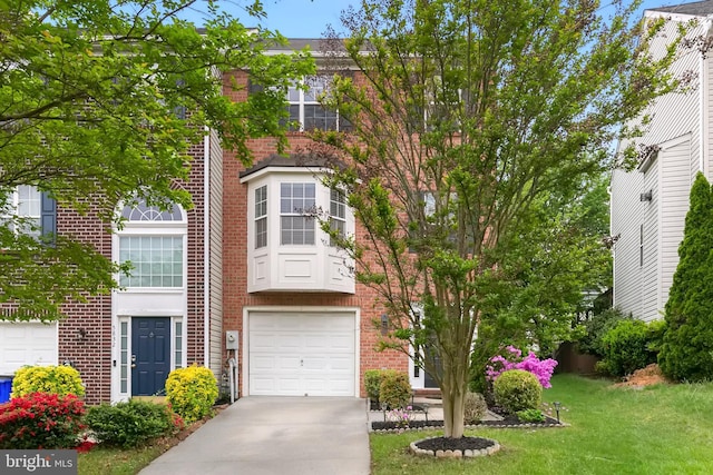 5830 Shady Oak Ln, Elkridge, MD 21075 - view of property with brick siding, concrete driveway, a front lawn, and an attached garage