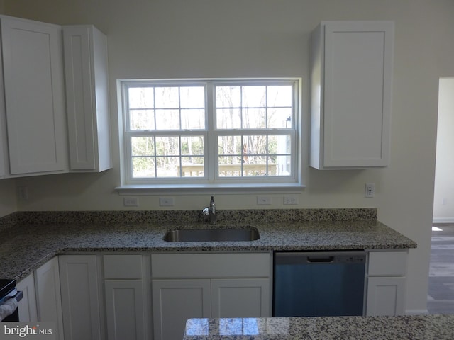 kitchen featuring a sink, white cabinets, dishwasher, and light stone countertops