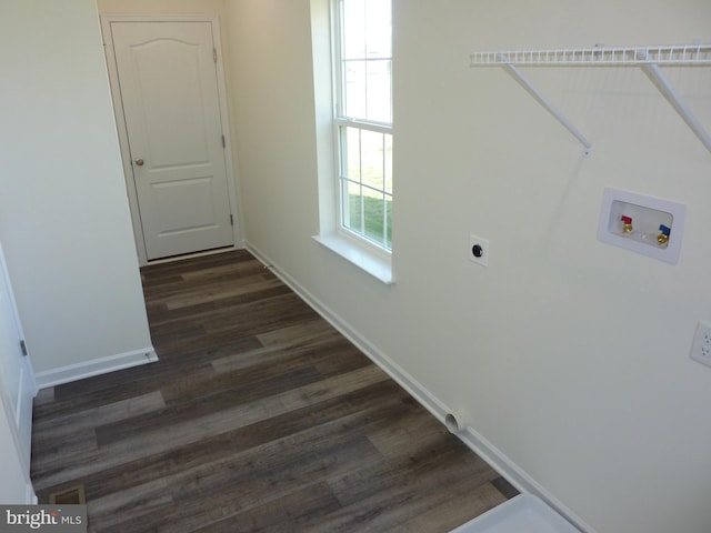 washroom with laundry area, dark wood-style flooring, washer hookup, hookup for an electric dryer, and baseboards