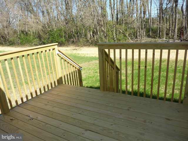 deck featuring a lawn