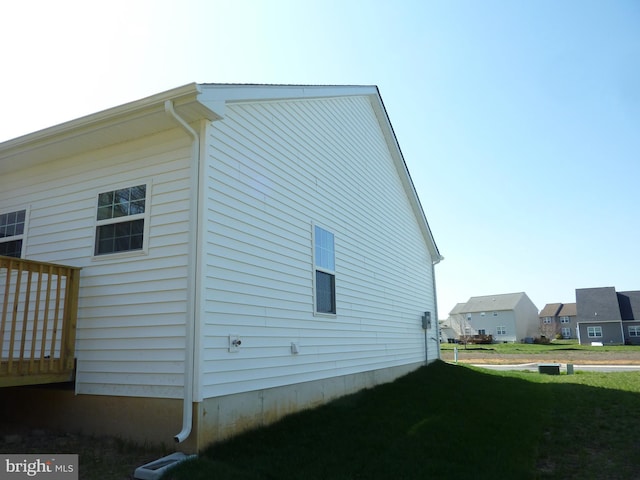 view of home's exterior featuring a yard