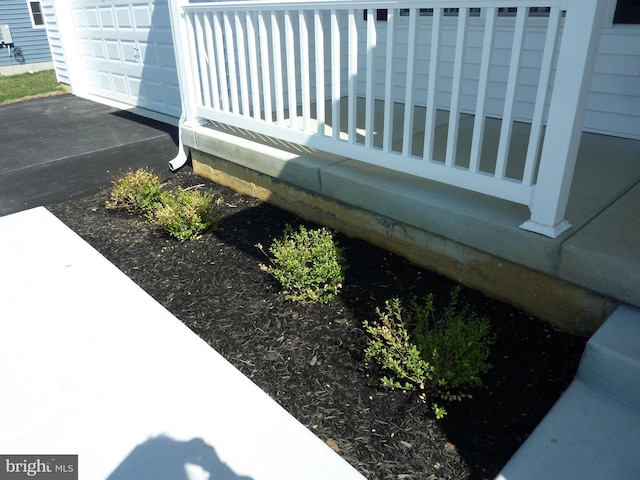 exterior details featuring aphalt driveway