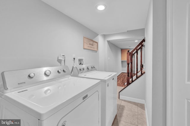 1823 Swansea Rd, Baltimore, MD 21239 - laundry room featuring washing machine and dryer, baseboards, laundry area, and light tile patterned floors