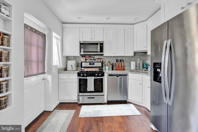 1823 Swansea Rd, Baltimore, MD 21239 - kitchen featuring white cabinets, appliances with stainless steel finishes, and a sink