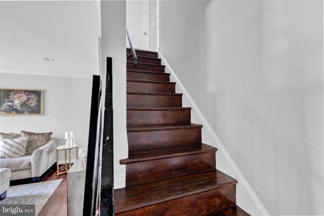 1823 Swansea Rd, Baltimore, MD 21239 - stairway with baseboards and wood finished floors