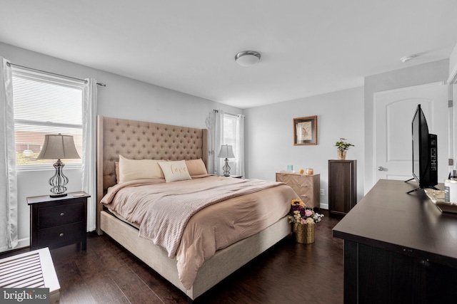 1823 Swansea Rd, Baltimore, MD 21239 - bedroom featuring multiple windows, baseboards, and dark wood-style flooring