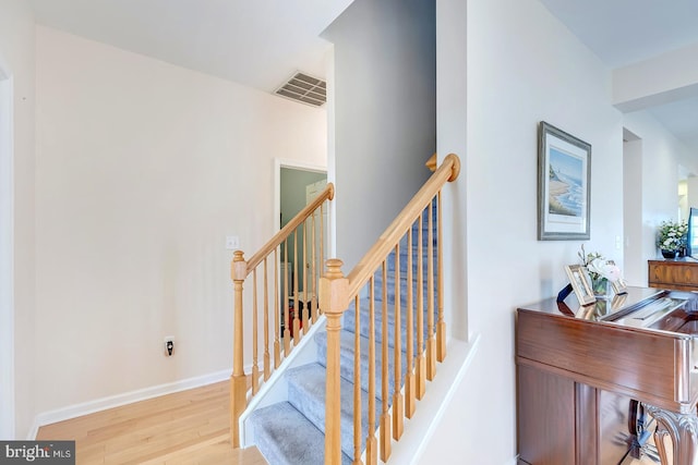 10 Cavendish Ct, Rehoboth Beach, DE 19971 - staircase featuring wood finished floors and baseboards