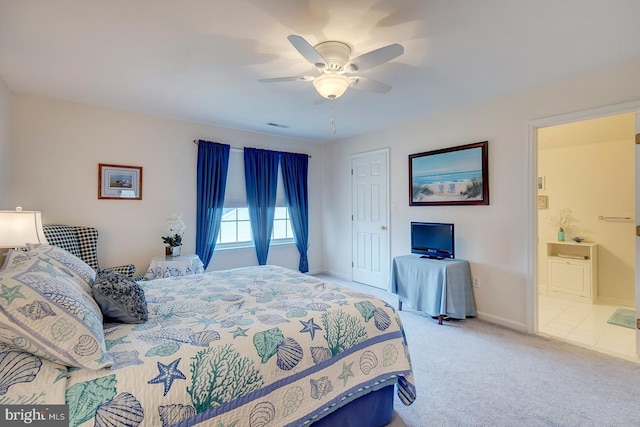10 Cavendish Ct, Rehoboth Beach, DE 19971 - carpeted bedroom featuring baseboards, ensuite bathroom, and ceiling fan
