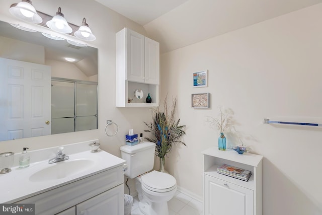 10 Cavendish Ct, Rehoboth Beach, DE 19971 - bathroom with vanity, toilet, vaulted ceiling, a shower with shower door, and tile patterned flooring