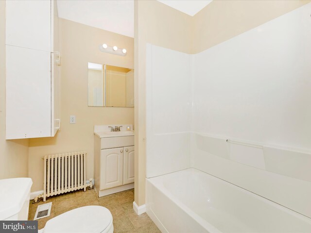 full bath with radiator heating unit, toilet, baseboards, tile patterned flooring, and vanity