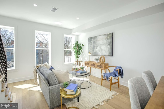 interior space with baseboards, visible vents, recessed lighting, and light wood finished floors