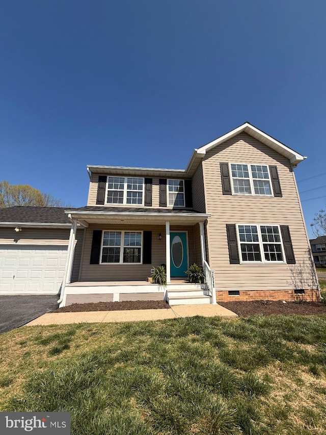 view of front of home with crawl space, a front yard, driveway, and a garage