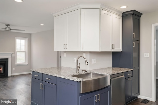 kitchen with white cabinetry, ceiling fan, a sink, and dishwasher
