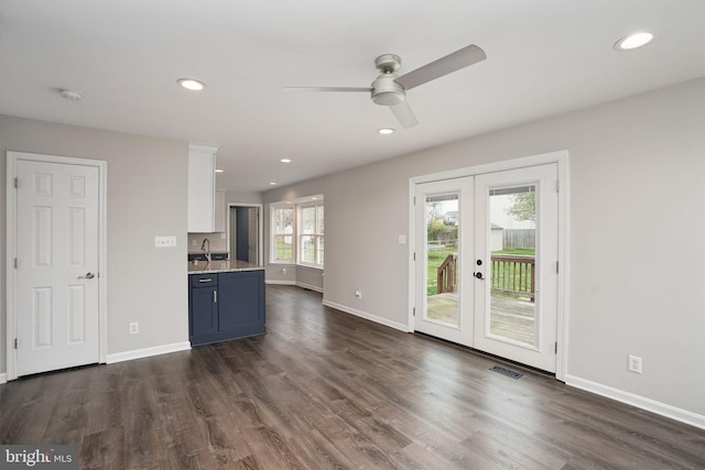 kitchen with baseboards, dark wood-style floors, french doors, and a ceiling fan