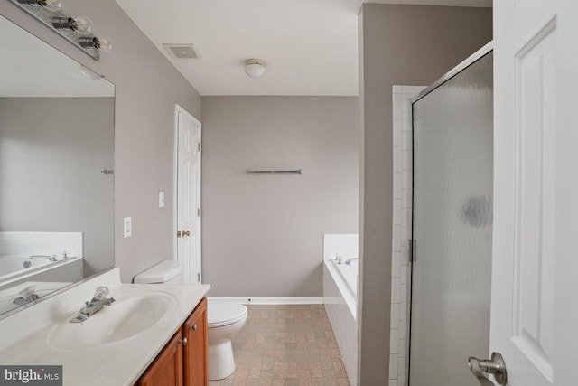 full bath featuring a stall shower, toilet, vanity, a bath, and baseboards