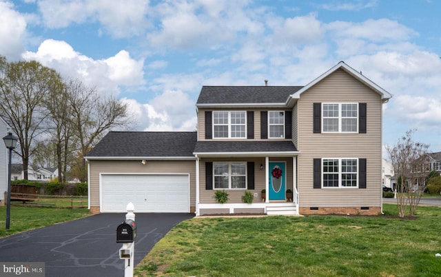 traditional-style home with a front yard, crawl space, aphalt driveway, and an attached garage