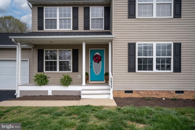 property entrance with crawl space, driveway, covered porch, and an attached garage