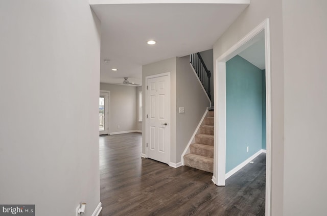 interior space with baseboards, dark wood-style flooring, recessed lighting, and stairway