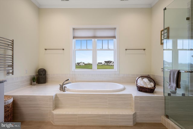 full bath with a garden tub, crown molding, a stall shower, radiator, and visible vents