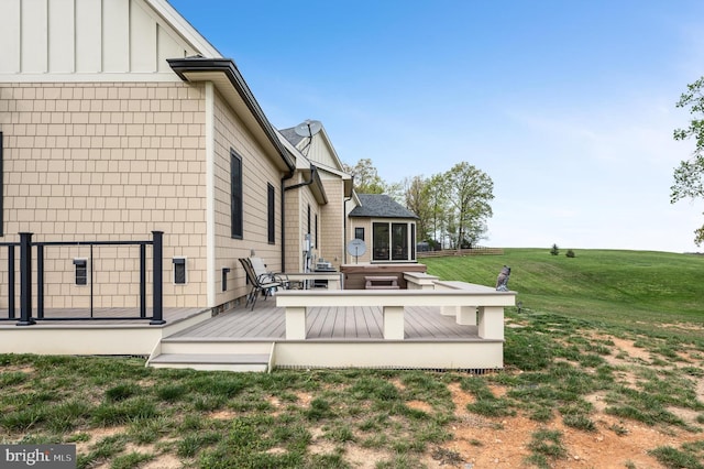 exterior space with a yard and a sunroom