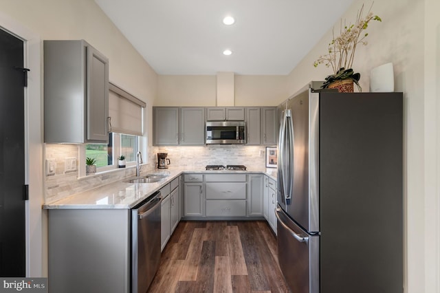 kitchen featuring a sink, appliances with stainless steel finishes, and gray cabinets