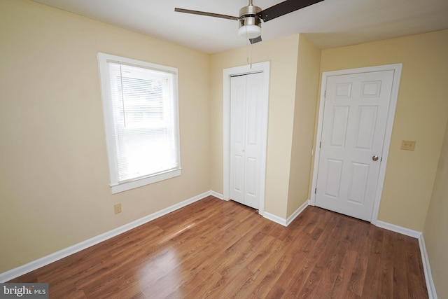 404 Sheldon Ave, Fruitland, MD 21826 - unfurnished bedroom with baseboards, ceiling fan, wood finished floors, and a closet