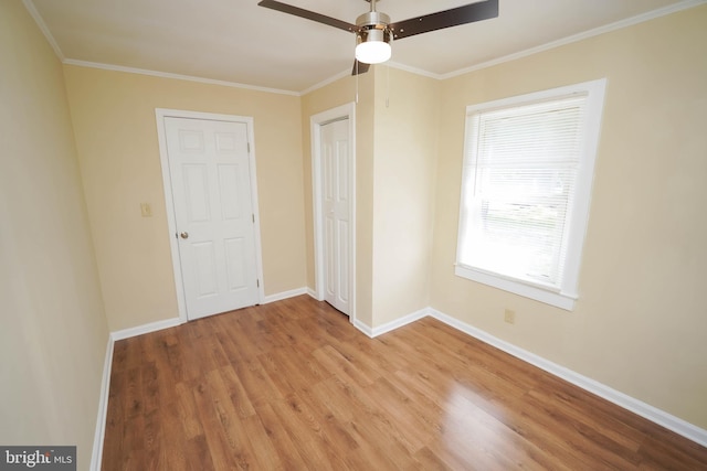 404 Sheldon Ave, Fruitland, MD 21826 - unfurnished bedroom with baseboards, a ceiling fan, light wood-style flooring, and crown molding