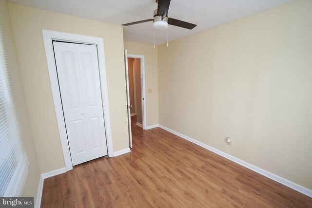 404 Sheldon Ave, Fruitland, MD 21826 - unfurnished bedroom featuring a closet, light wood finished floors, ceiling fan, and baseboards