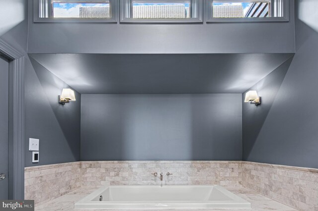 bathroom with a garden tub
