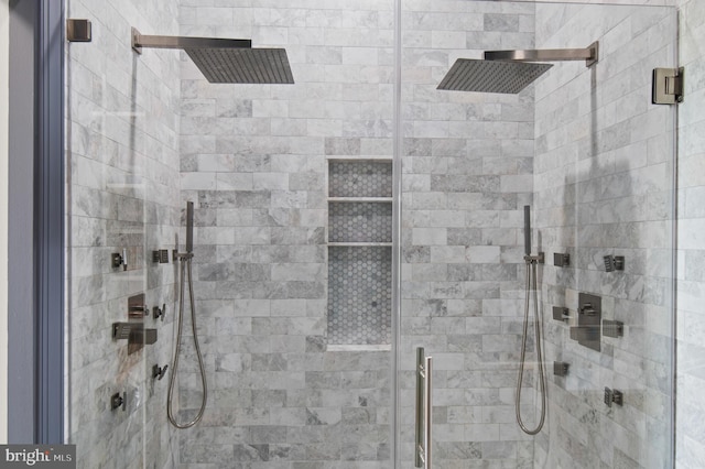 full bath featuring a shower stall