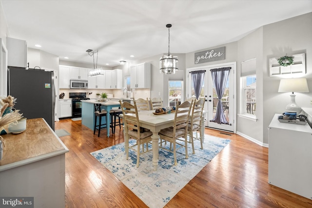 25 Mica St, Townsend, DE 19734 - dining space with an inviting chandelier, light wood-type flooring, recessed lighting, french doors, and baseboards
