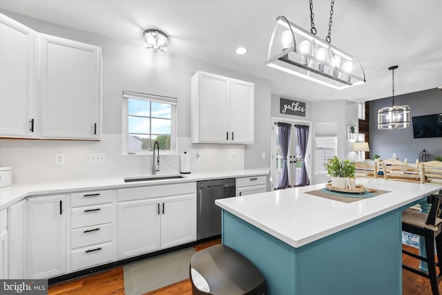 25 Mica St, Townsend, DE 19734 - kitchen with a kitchen breakfast bar, white cabinetry, dark wood-style flooring, dishwasher, and a sink