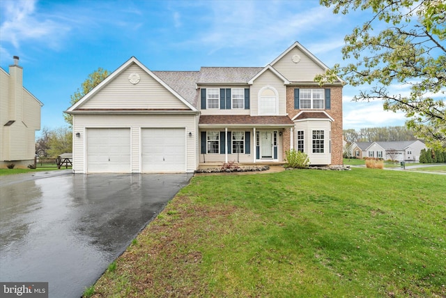 25 Mica St, Townsend, DE 19734 - view of front of property with aphalt driveway, a garage, and a front lawn