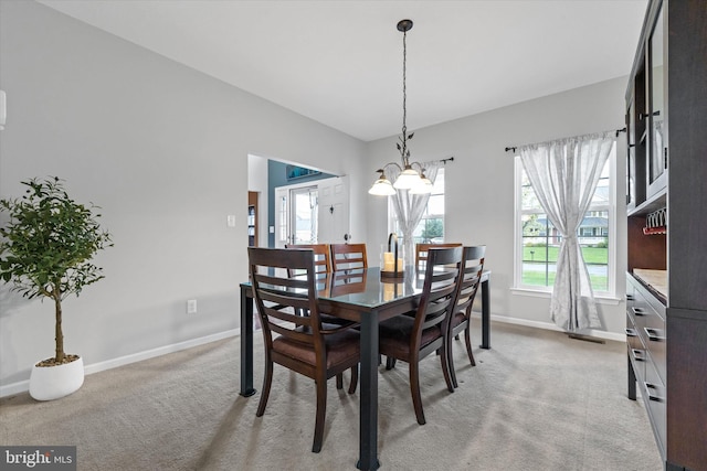 25 Mica St, Townsend, DE 19734 - dining space with light carpet, an inviting chandelier, and baseboards