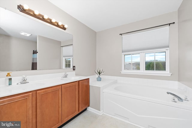 25 Mica St, Townsend, DE 19734 - bathroom with a garden tub, double vanity, a sink, and visible vents