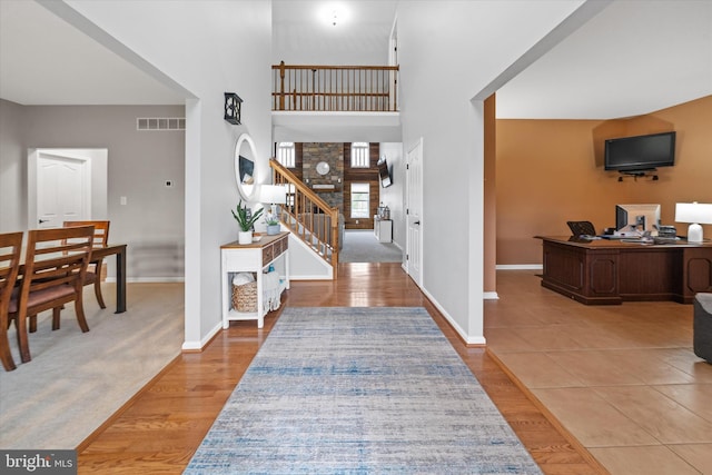 25 Mica St, Townsend, DE 19734 - foyer entrance with stairs, a towering ceiling, visible vents, and baseboards