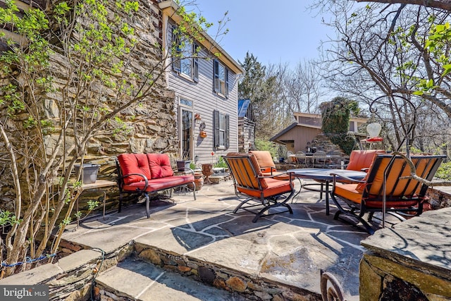 view of patio featuring an outdoor hangout area and outdoor dining area