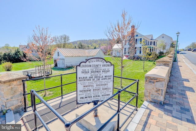 view of community featuring a yard