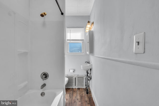 bathroom featuring shower / tub combination and wood finished floors