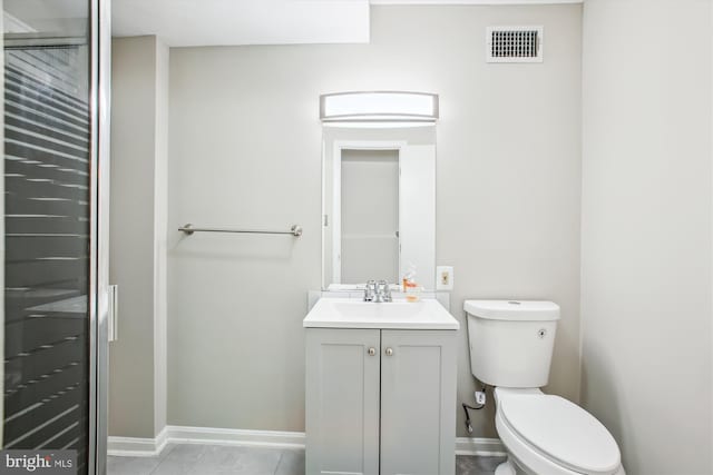 bathroom featuring visible vents, tile patterned flooring, vanity, toilet, and baseboards