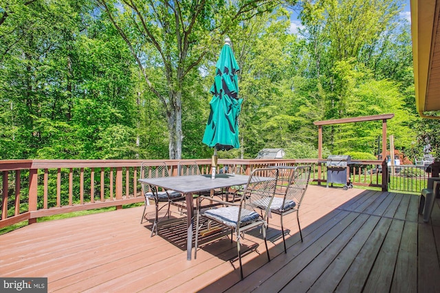 deck featuring outdoor dining area