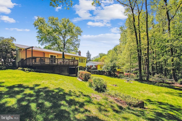 view of yard featuring a wooden deck