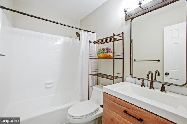 full bathroom with vanity, shower / tub combo with curtain, and toilet