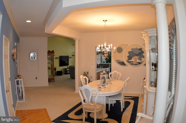 dining room featuring ornate columns, an inviting chandelier, light carpet, and recessed lighting