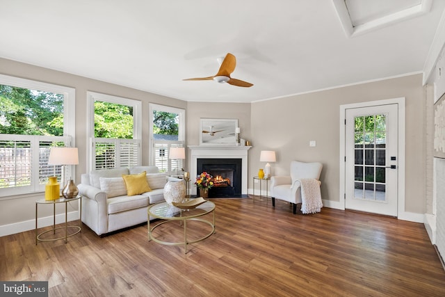 8620 Conover Pl, Alexandria, VA 22308 - living area with a fireplace with flush hearth, baseboards, wood finished floors, a ceiling fan, and ornamental molding
