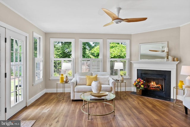 8620 Conover Pl, Alexandria, VA 22308 - living room featuring plenty of natural light, wood finished floors, and ornamental molding